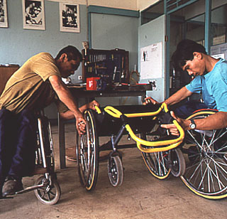 File:Inspecting a finished wheelchair.jpg