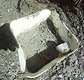 Bucket filled with concrete to avoid large amounts of standing water