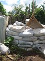 these sacks full of dirt found on site were the source of earth for our superadobe