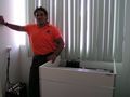 Antonio, Centro de Salud technician, and the Sunfrost refrigerator.