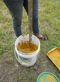 Mixing mixed oxide to lime wash.jpg