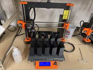 Hobbyist 3D printer making battery shoes