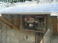 A solar panel was added to the system by a group after Ecofficiency had installed the system. The solar panel charged a battery, which ran the pump. The panel and battery could not provide the system with a reliable enough energy supply to keep it functioning without additional power.