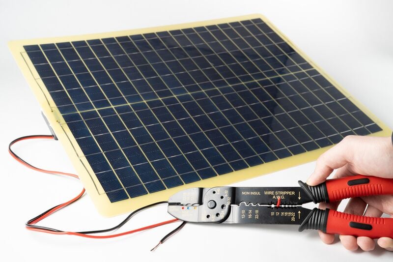 File:To Catch the Sun Ecoworthy 20W panel with wire strippers.jpg