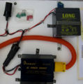 Fig 5: Close-up of the inverter, battery, DC plug and spare fuses.