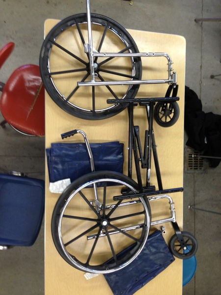 File:Up cycled coffin wheel chair disassemble.jpg