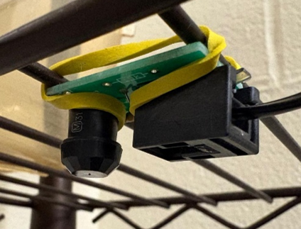 File:PIR sensor PCB attached to cage.png