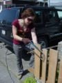 Here I am sawing the bamboo to fit into the canvas.