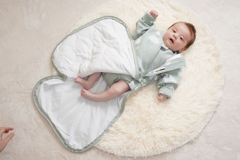 File:An-infant-in-a-wearable-swaddle-blanket.jpg