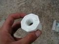 One-and-a-half to one-half inch PVC reducer.