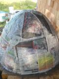 Fig.13 After the sand dome was created, we covered it with Newspaper. When we excavate the sand from the finished oven the newspaper will be an indicator of when we reached the inside layer