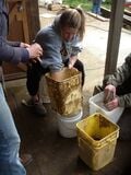 Fig 6: Morgan and Cody prepare test batches of earthen plaster.