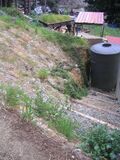 Note the convex/bowl shape of the slope. Note the steps running parallel with the CCAT house and the base of the slope.