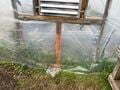 Reinforcing the bottom of the greenhouse to be able to hold the fan and exhaust shutters.