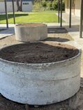 The planters were completely filled with soil using shovels and wheelbarrows.