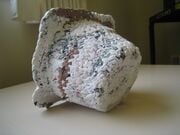 Hot Dang Plastic Encasement Waste plastic bags available in Haiti cleaned, cut, crocheted and ironed into a hard plastic mold
