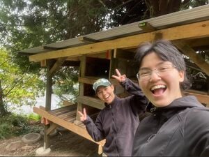 Suzuki and Michelle after completion of the shelves