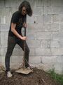 A tamp is used to level out the sides of the hole.