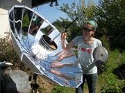 Sunbrella An umbrella in the rain, a solar cooker in the Sun