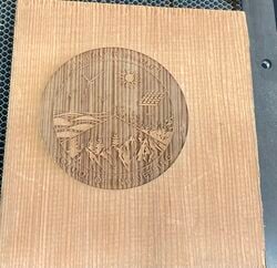 A prototype made from scrap wood, to test how the laser cutter engraved wood.