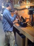 Fig 3: Jerome (HSU student) filing one of the beams in John's shop.