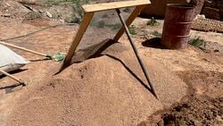 sievering the earth, e.g. to get rid of big rocks or to get a finer adobe mix