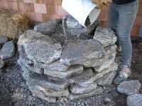 Fig.3 Pouring rubble and sand in the foundation to give it support