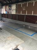 Step 12. Remove linoleum floor on a warm day to help adhesive peel off easier. Remove plywood subfloor by cutting into smaller sections with a Skil saw (do not cut through to metal floor) and use leverage from a pry-bar to remove stubborn nails from the metal floor.