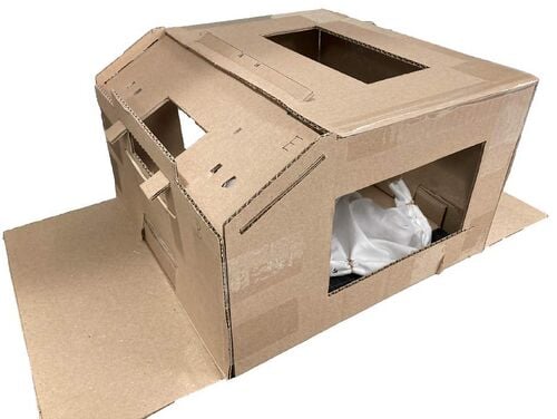 Completed Meckel's Diverticulectomy Simulator showing white fabric bowel module inside a cardboard box trainer