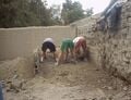 Fig 3: Since there were large rocks filling the foundation it was hard to shovel out the dirt. Resorting to digging the rocks out with our hands was the easiest way to go about it.