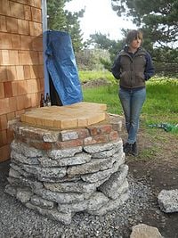 Fire bricks on a finished base with megan.jpg