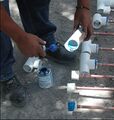 Installing T's on the PVC reducers.