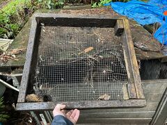 CCAT Handheld Compost Sifter. Made with 2x4's and wire mesh. Primitive and labor intensive.