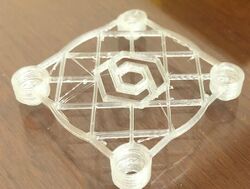 A print of the fan cover for the extruder.