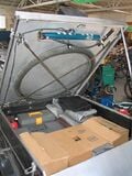The trike tool and motor (cargo) compartment. The motor is located under the center brown box. The compartment is a garder cart with an aluminum lid and front panel.