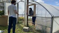 Mounting the fan box to the greenhouse.
