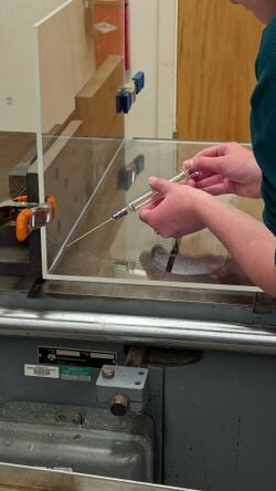 Applying Weld On 4 with metal syringe
