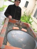 The brick halves were then positioned between the back of the primary burner and the small burner mold, as indicated in the image. Once proper positioning was attained the primary burner and secondary burner mold were removed