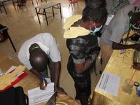 An orthopaedic officer fills the self assessment form after drilling the bone simulator prototype.