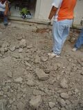 Fig: Using the standing office building and the old adobe wall as points of reference, the layout of the foundation was made using string and rebar posts.