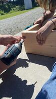 Drilling the wood to make the fan mount.