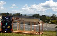 Animal visitation center A chicken coop and separate goat enclosure that are both designed to be inside a classroom.