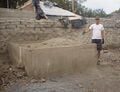 Fig 2: The concrete foundation of this once huge oven had to be removed from the site. However, it was filled with dirt and rocks that had to be removed in order to destroy it.