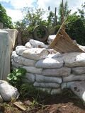 these sacks full of dirt found on site were the source of earth for our superadobe.