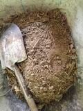 The mortar was 1 part river sand, to 1 part dirt, to 1/2 parts straw. Water was added before applying the mortar.