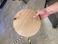 A circle cut out of thicker wood using the completed jig