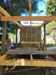 Shed framed with reclaimed wood floorboards done by Suzuki