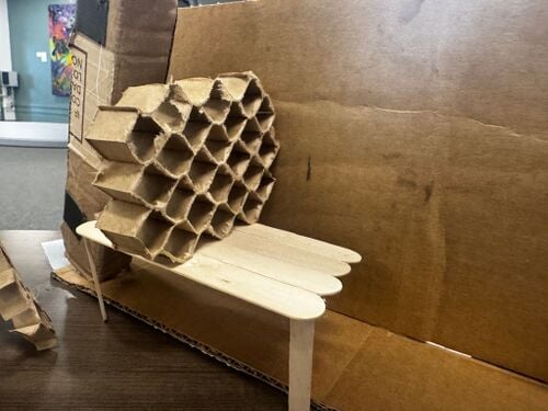 This is an example of one of the possibilities for a table in the study area. This option includes a divider on the table made with hexagons to represent the honeycomb.