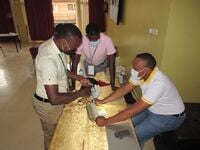 A medical officer drills the bone simulator prototype