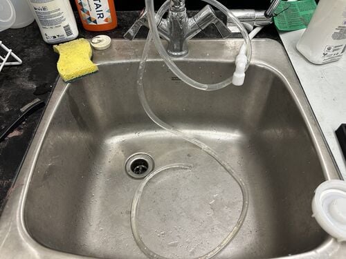 Water fill hose used to add water to the WAZER tank before cutting.